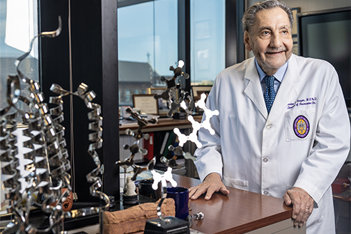 Dr. Bazan with molecule model